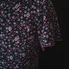Casual floral dress with a V-neck and short sleeves, featuring pink and purple hues. Sleeve close-up showcasing floral rosy pattern.