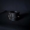 Black leather wristband with stainless steel spikes in assymetrical placement. Intertwined rings forming a chain and connecting th center large steel o-ring. A unique twist to a classis alternative fashion accessory of gothic or punk styles.